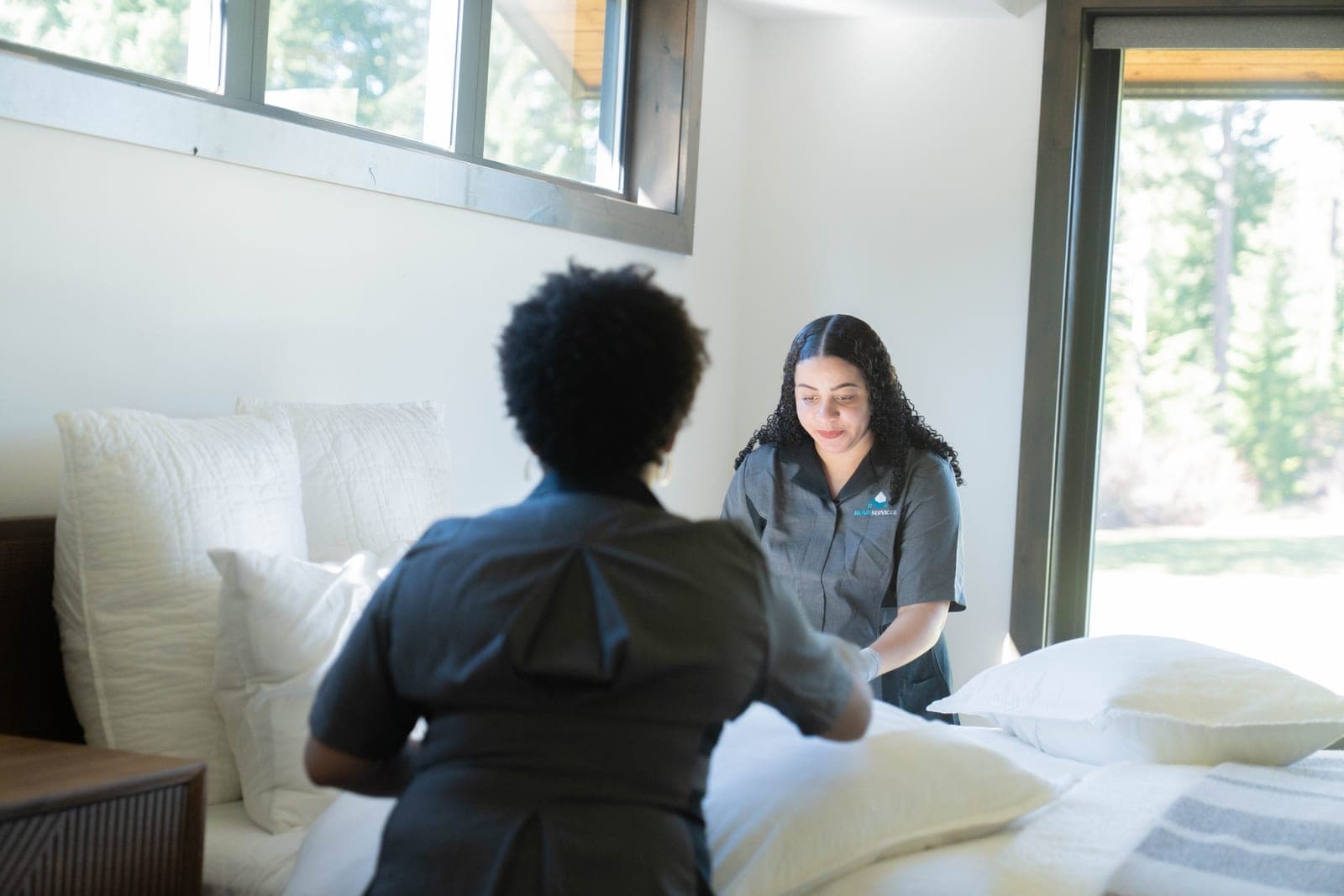 Professional cleaners working in a modern home