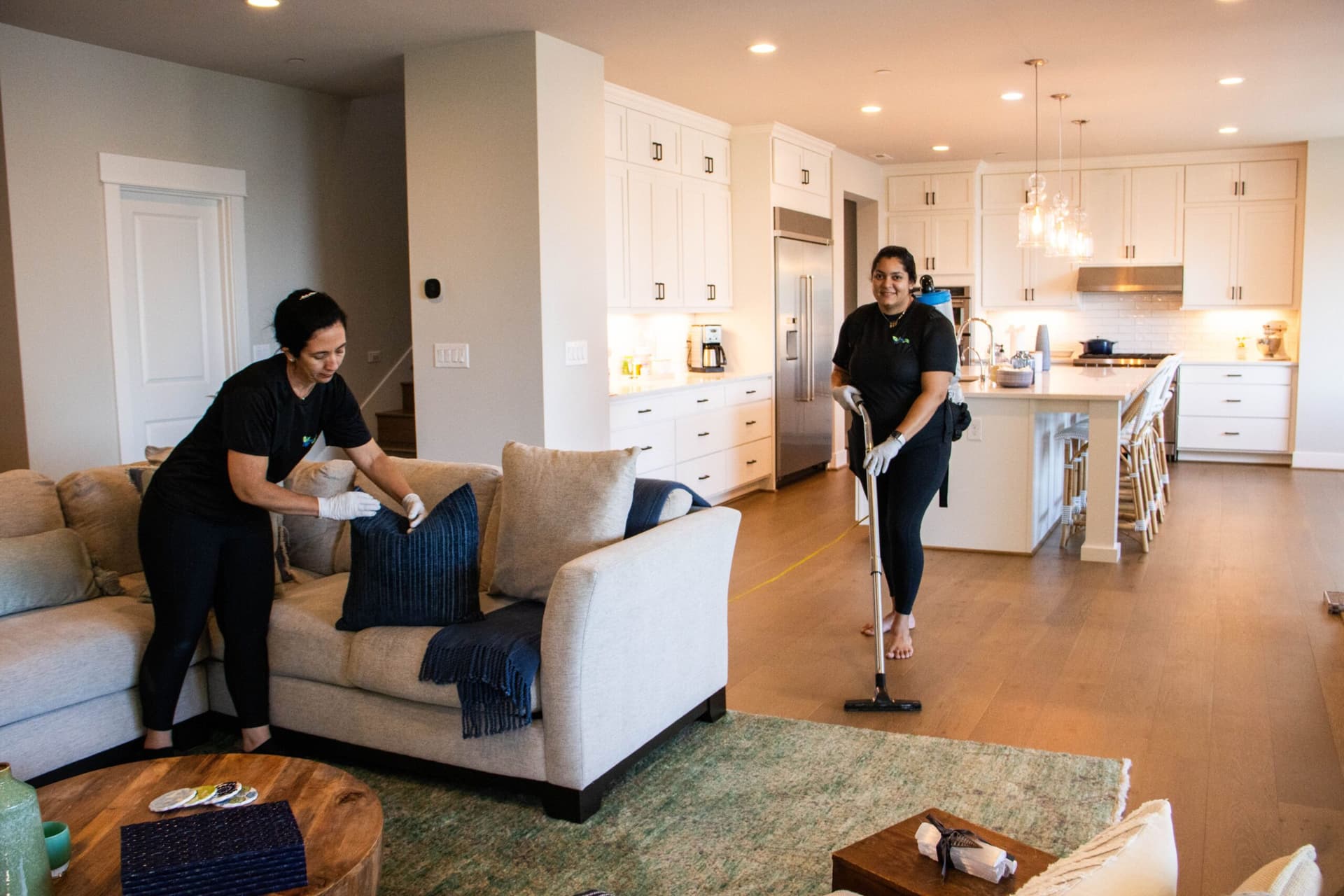 Professional cleaners working in a modern home